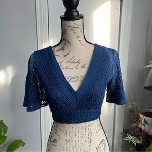 Blue, lace, boho crop top with cute bow tie in the back.